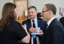 Yalta Annual Metting lobby with a cup of coffee 