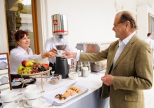 Yalta Annual Metting lobby with a cup of coffee 