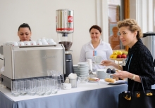 Yalta Annual Metting lobby with a cup of coffee 