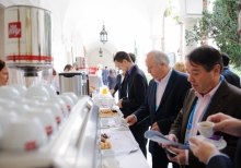 Yalta Annual Metting lobby with a cup of coffee 