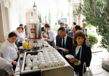 Yalta Annual Metting lobby with a cup of coffee 